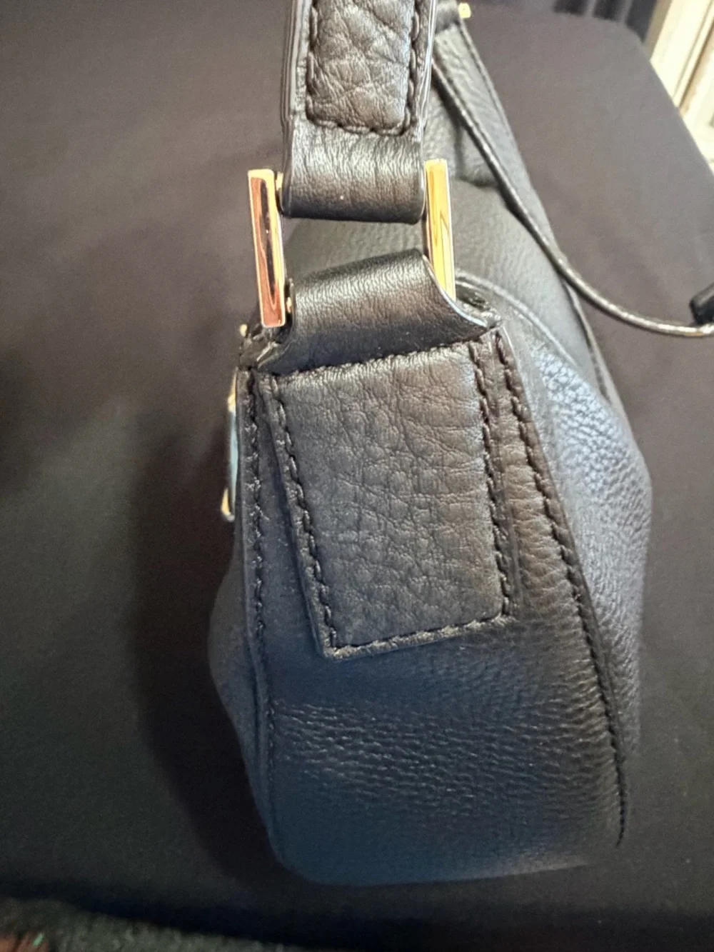 Kate Spade Black Saddle Bag Like New Condition. Very stylish and comfortable.